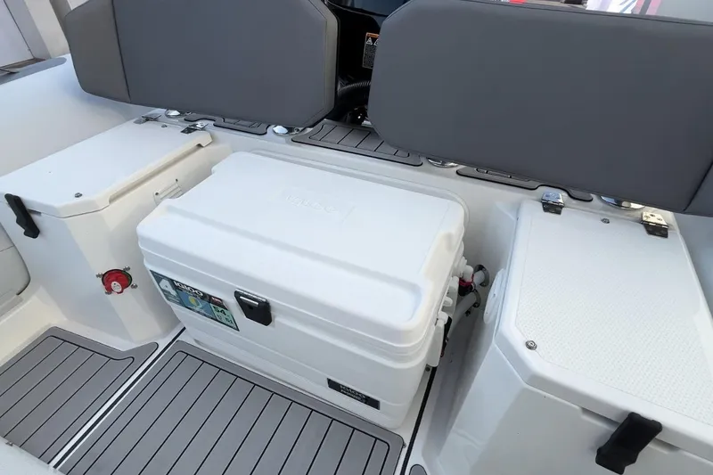 Slide: The Image of Interior of 2026 Northstar VEGA 5.4 boat with storage compartments and cooler. - 14