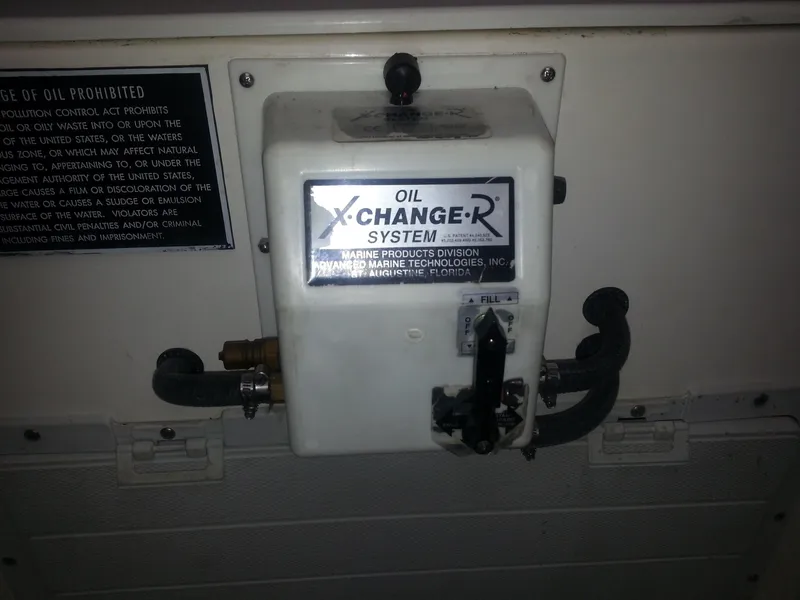 Slide: The Image of Oil change system on a 2001 Cabo 35 Express boat. - 27