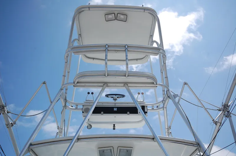 Slide: The Image of 2001 Cabo 35 Express boat tower against a clear blue sky. - 29