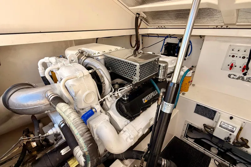 Slide: The Image of Engine room of 2001 Cabo 35 Express boat with Caterpillar engine components. - 39
