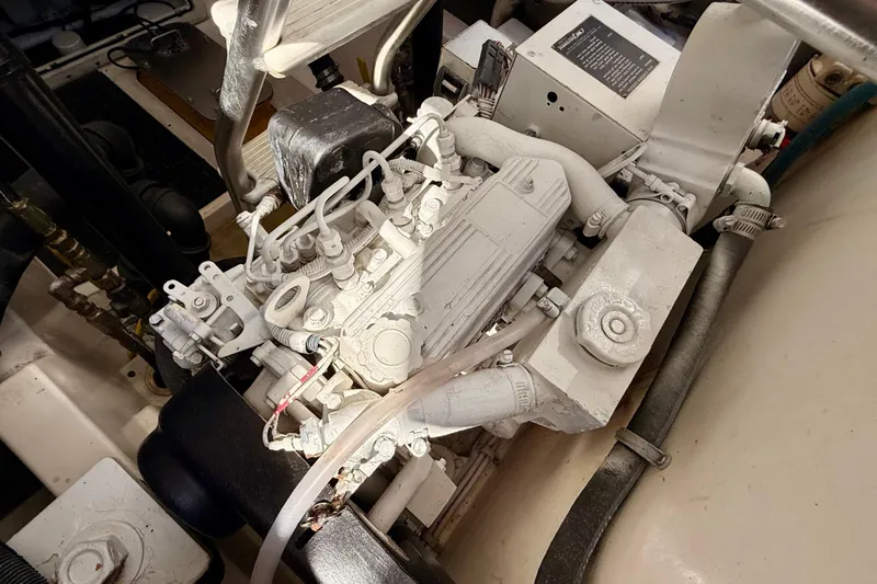 Slide: The Image of Engine compartment of a 2001 Cabo 35 Express boat, showcasing mechanical components. - 41