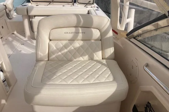 Slide: The Image of 2022 Grady-White Freedom 275 boat seat with quilted upholstery and logo. - 15