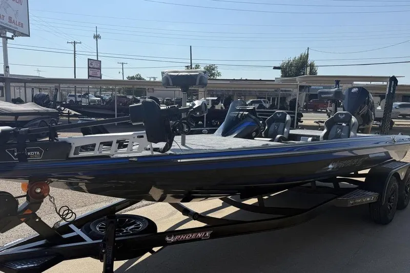 Slide: The Image of 2026 Phoenix 920 Elite X boat on trailer in outdoor dealership lot. - 12