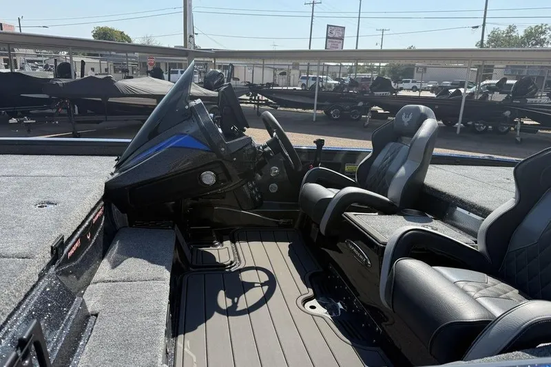 Slide: The Image of Interior of 2026 Phoenix 920 Elite X boat with sleek seating and modern dashboard. - 13