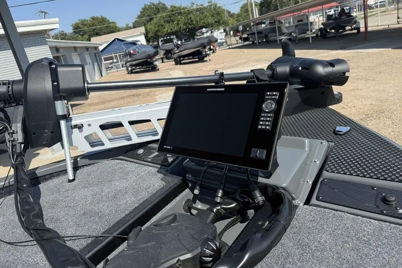 Slide: The Image of 2026 Phoenix 920 Elite X boat dashboard with Humminbird fish finder and trolling motor. - 14