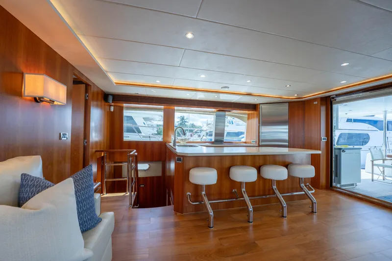 Slide: The Image of Luxurious interior of 2016 Horizon PC60 yacht with modern kitchen and seating area. - 11