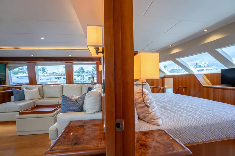 Slide: The Image of Luxurious interior of 2016 Horizon PC60 yacht with elegant seating and bedroom area. - 13
