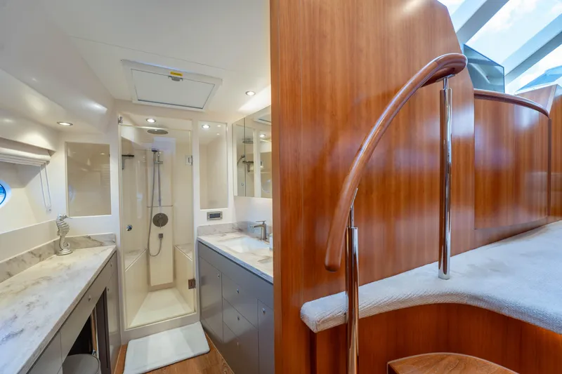 Slide: The Image of Luxurious bathroom in 2016 Horizon PC60 yacht with modern shower and elegant wood finishes. - 19