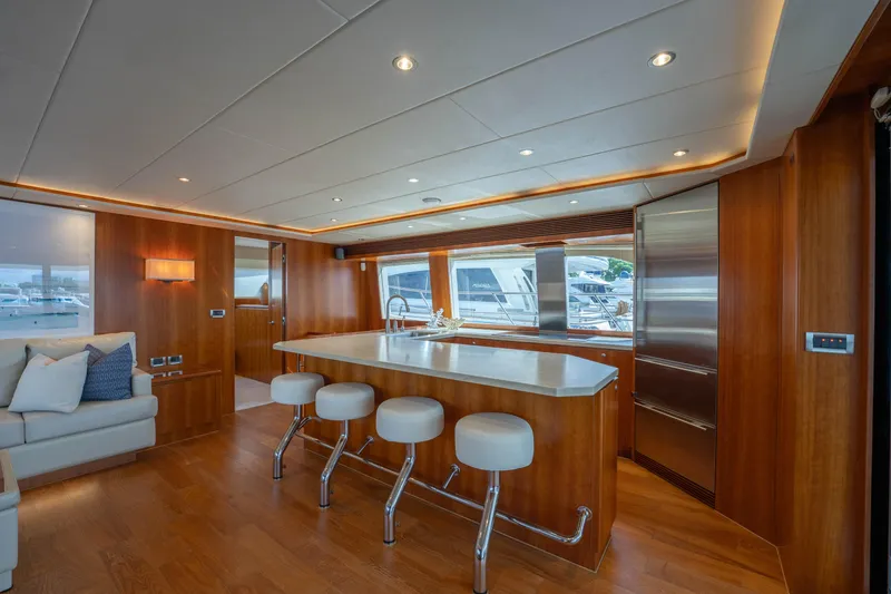 Slide: The Image of Luxurious 2016 Horizon PC60 yacht interior with modern kitchen and seating area. - 2