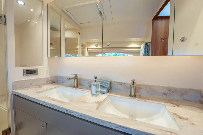 Slide: The Image of Luxurious Horizon PC60 2016 yacht bathroom with dual sinks and elegant fixtures. - 21