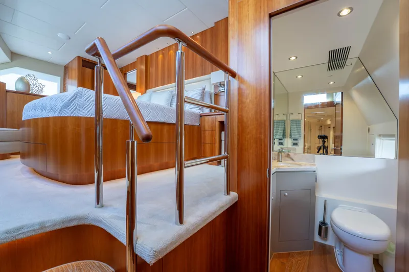 Slide: The Image of Luxurious 2016 Horizon PC60 yacht interior with elegant wood finishes and modern bathroom. - 24