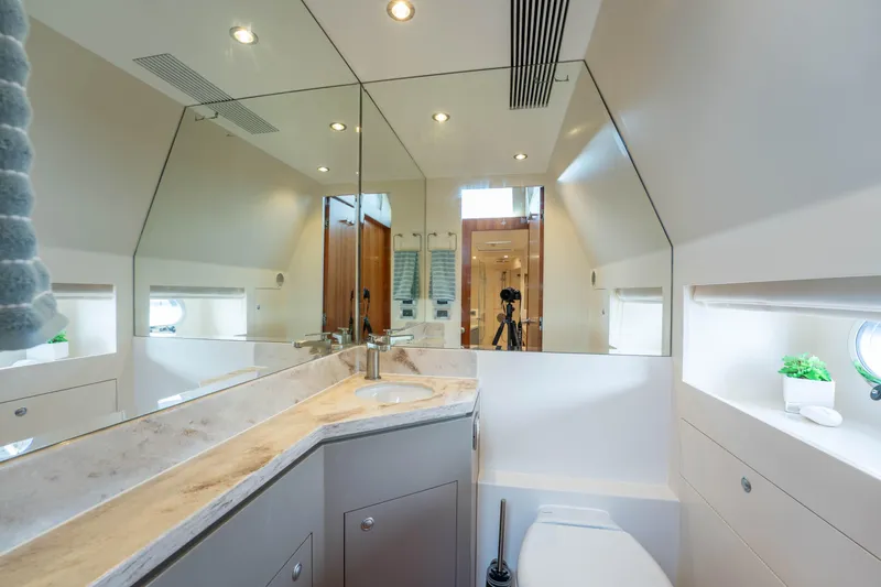 Slide: The Image of Luxurious bathroom interior on a 2016 Horizon PC60 yacht, featuring modern fixtures and elegant design. - 25