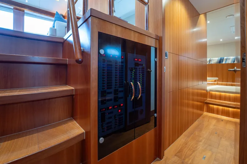 Slide: The Image of Luxurious wooden interior of 2016 Horizon PC60 yacht with control panel and stairs. - 26