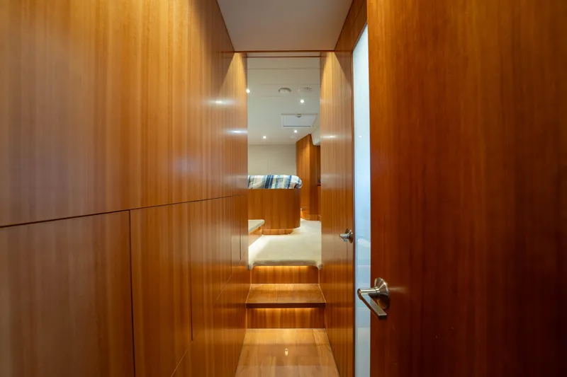 Slide: The Image of Luxurious wooden interior of 2016 Horizon PC60 yacht cabin hallway. - 27