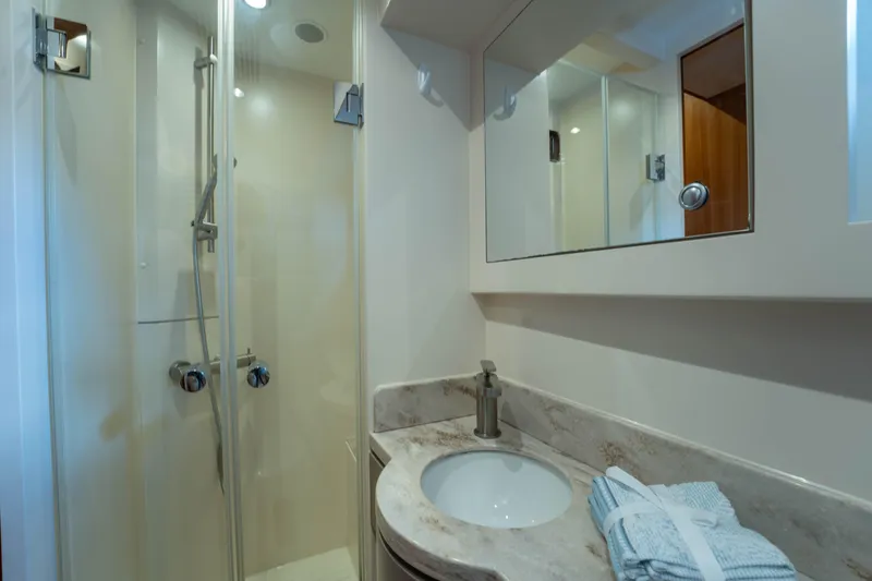 Slide: The Image of Modern bathroom in 2016 Horizon PC60 yacht with shower and marble sink. - 30