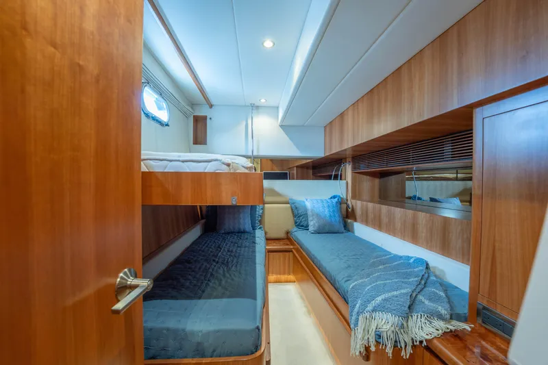 Slide: The Image of Luxurious 2016 Horizon PC60 yacht cabin with wooden interior and cozy bedding. - 36