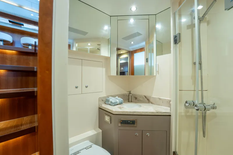 Slide: The Image of Luxurious bathroom in 2016 Horizon PC60 yacht with modern fixtures and elegant design. - 37
