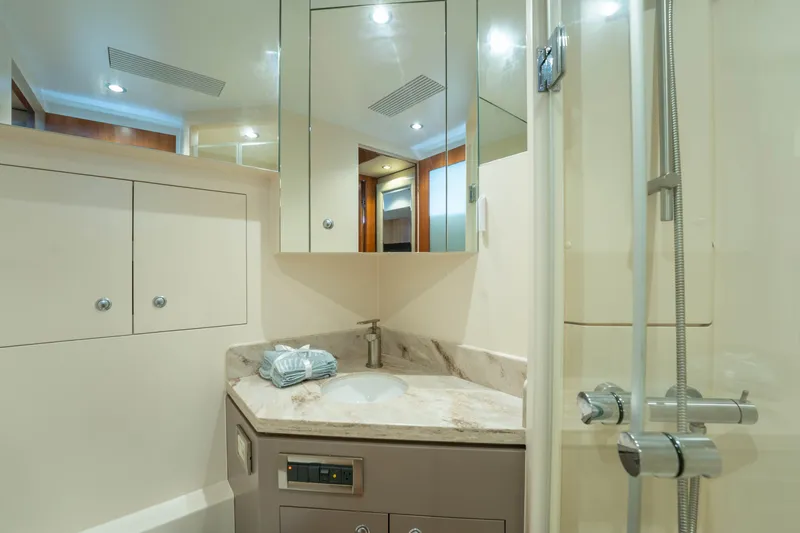 Slide: The Image of Luxurious bathroom in 2016 Horizon PC60 yacht with modern fixtures and elegant design. - 38