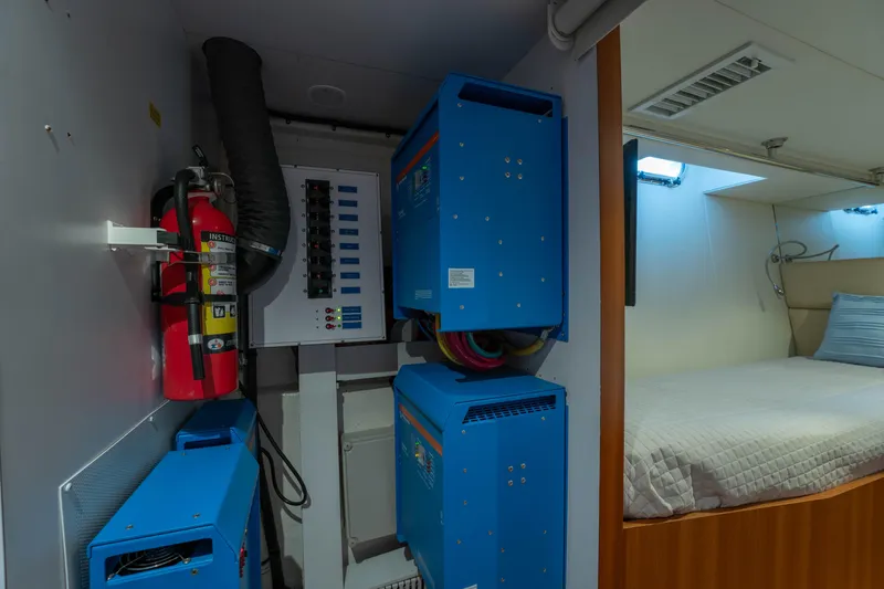 Slide: The Image of Electrical panel and fire extinguisher in Horizon PC60 yacht, 2016 model, near cabin. - 42