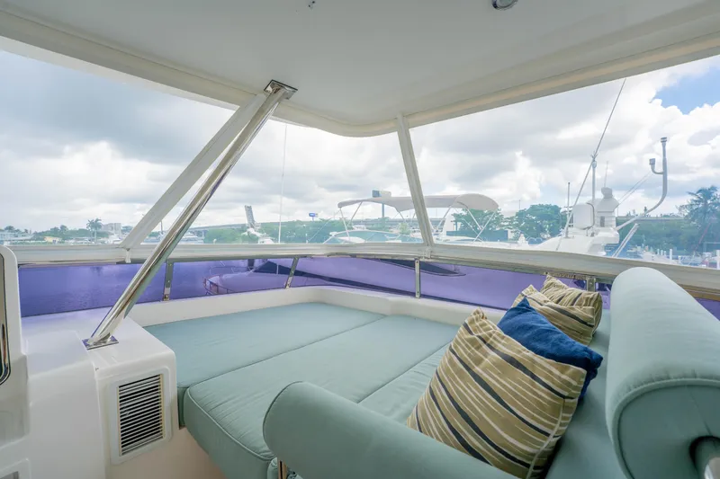 Slide: The Image of Luxurious interior of 2016 Horizon PC60 yacht with comfortable seating and scenic marina view. - 53