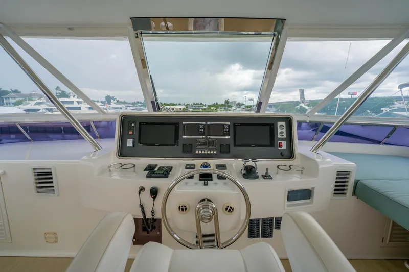 Slide: The Image of Helm of 2016 Horizon PC60 yacht with modern navigation equipment and panoramic view. - 54