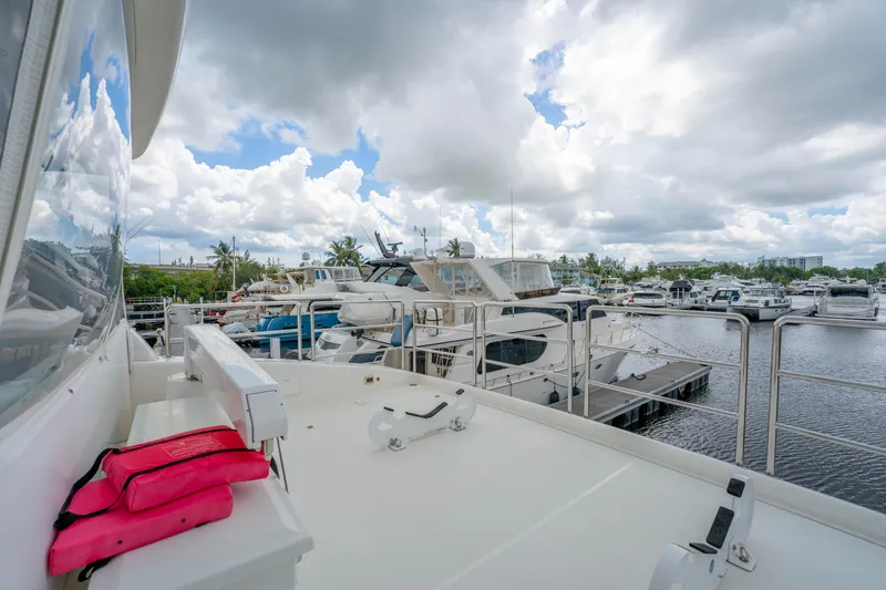 Slide: The Image of 2016 Horizon PC60 yacht docked at marina under cloudy sky. - 56