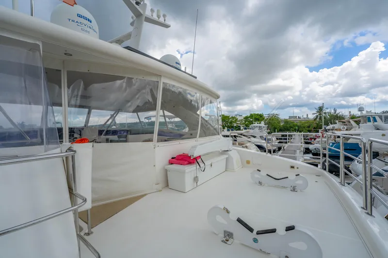 Slide: The Image of Luxury Horizon PC60 yacht deck, 2016 model, docked under cloudy skies. - 57