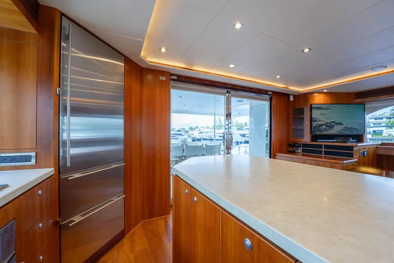 Slide: The Image of Luxurious 2016 Horizon PC60 yacht interior with modern kitchen and entertainment area. - 6