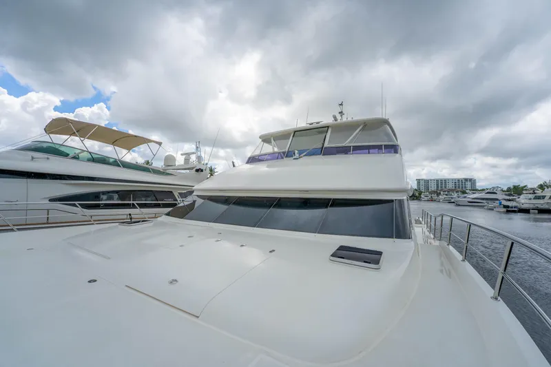 Slide: The Image of Luxury Horizon PC60 yacht docked under cloudy skies, 2016 model. - 60
