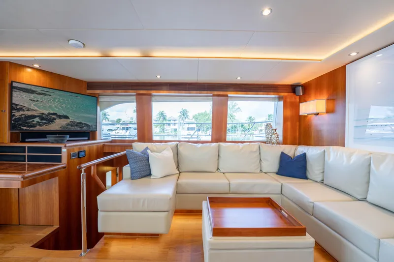 Slide: The Image of Luxurious 2016 Horizon PC60 yacht interior with white leather seating and large windows. - 8