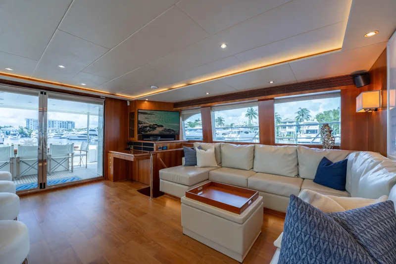 Slide: The Image of Luxurious interior of 2016 Horizon PC60 yacht with spacious seating and marina view. - 9