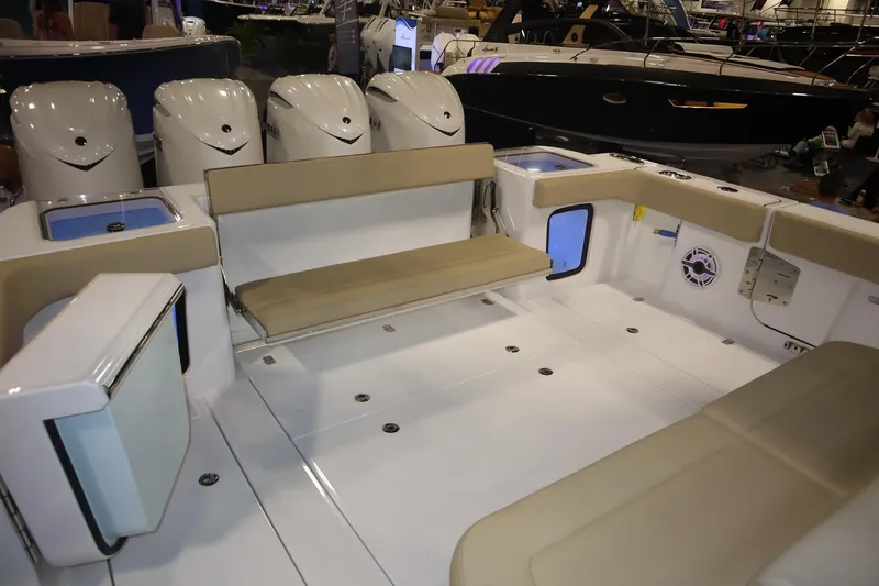 Slide: The Image of 2026 Sportsman Open 402 Center Console boat interior with seating and multiple outboard engines. - 16
