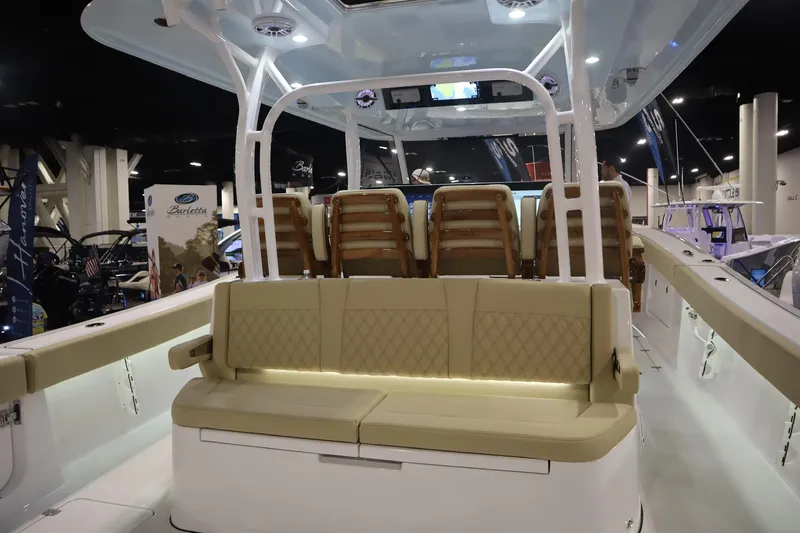 Slide: The Image of 2026 Sportsman Open 402 Center Console boat interior with beige seating and modern design. - 17