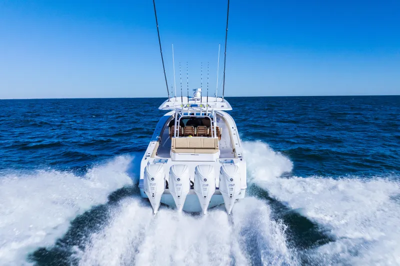 Slide: The Image of 2026 Sportsman Open 402 Center Console boat cruising on open ocean waters. - 2