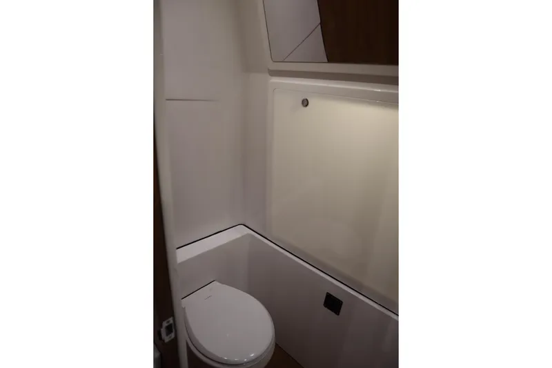 Slide: The Image of 2026 Sportsman Open 402 Center Console boat interior bathroom with modern design. - 20