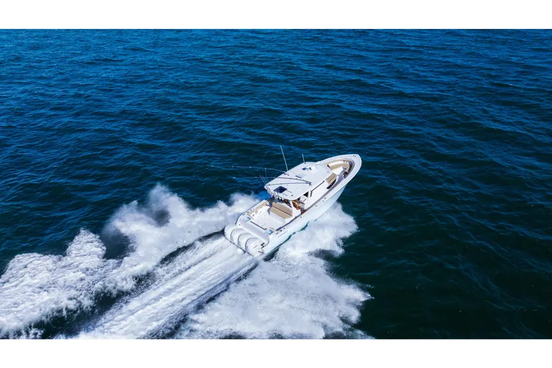 Slide: The Image of 2026 Sportsman Open 402 Center Console cruising on open ocean waters. - 3
