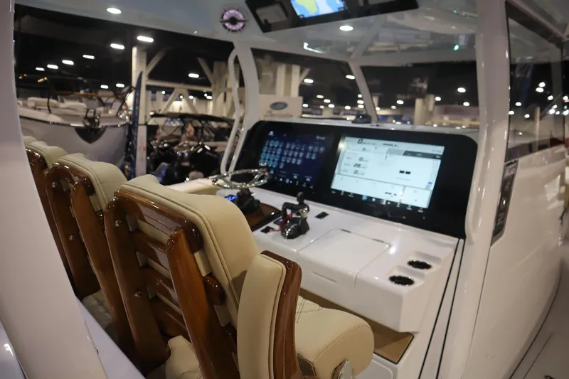 Slide: The Image of 2026 Sportsman Open 402 Center Console with advanced navigation display and luxurious seating. - 5