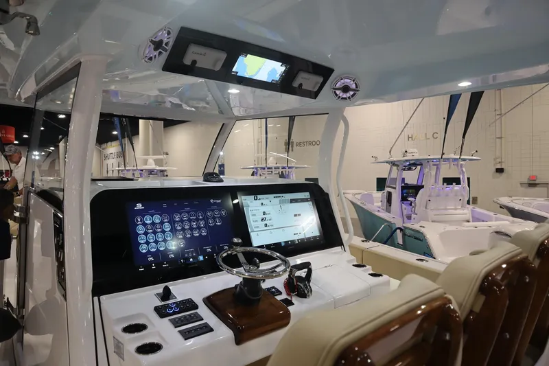 Slide: The Image of 2026 Sportsman Open 402 Center Console boat interior with advanced navigation displays. - 6