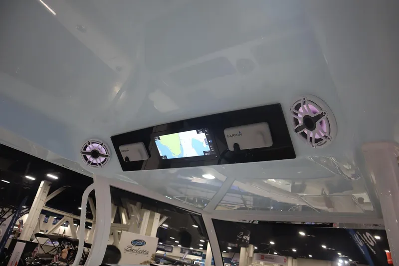 Slide: The Image of 2026 Sportsman Open 402 Center Console with Garmin display and speakers in cabin ceiling. - 7