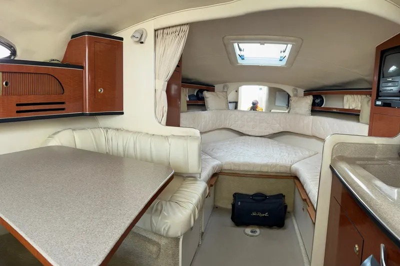 Slide: The Image of Bow of 2003 Sea Ray 280 Sundancer with anchor and rope details. - 12