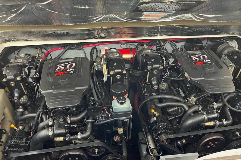 Slide: The Image of Twin MerCruiser 5.0 MPI engines in a 2003 Sea Ray 280 Sundancer boat. - 2