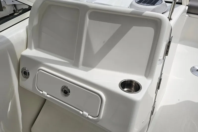 Slide: The Image of WorldCat 255 DC 2018 boat interior with storage compartment and cup holder. - 10
