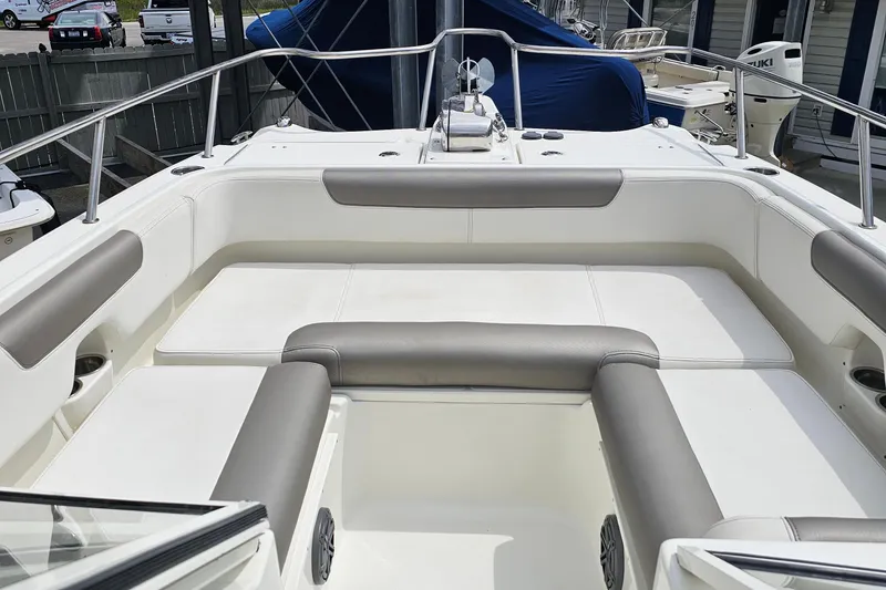 Slide: The Image of 2018 WorldCat 255 DC boat interior with cushioned seating and stainless steel railings. - 14
