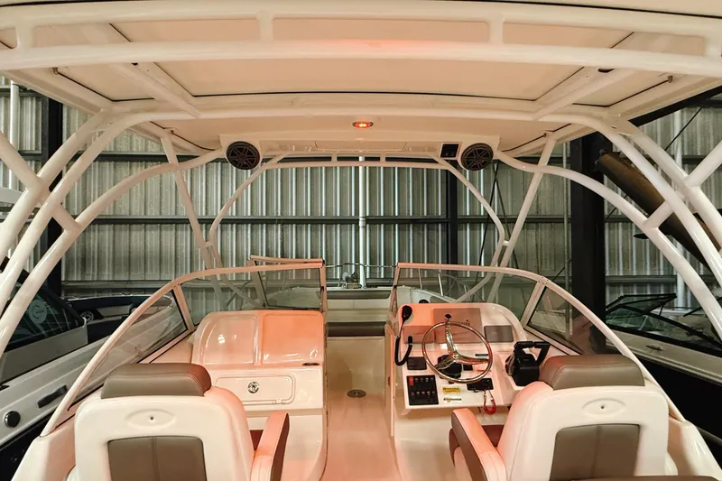 Slide: The Image of Interior view of a 2018 WorldCat 255 DC boat, featuring dual consoles and seating. - 17