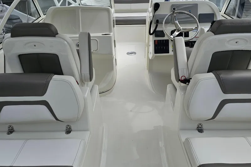 Slide: The Image of Interior of 2018 WorldCat 255 DC boat with modern seating and steering wheel. - 4