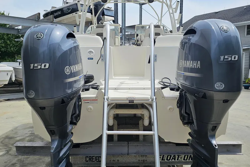 Slide: The Image of Twin Yamaha 150 outboard motors on a 2018 WorldCat 255 DC boat. - 5