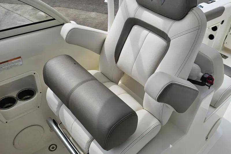 Slide: The Image of Luxurious seating on 2018 WorldCat 255 DC boat, featuring plush white and gray upholstery. - 8