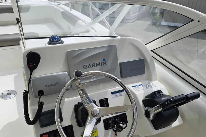 Slide: The Image of Steering console of 2018 WorldCat 255 DC boat with Garmin and Yamaha controls. - 9