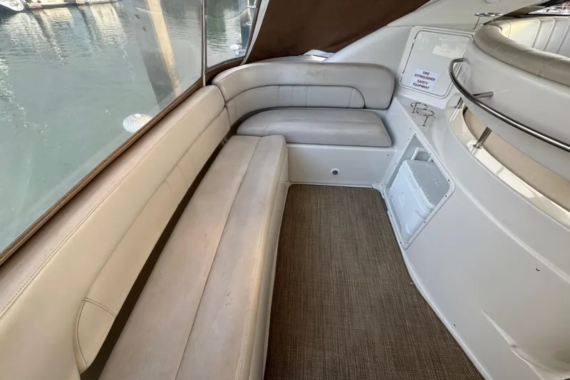 Slide: The Image of 2002 Regal Commodore 3860 yacht interior with beige seating and carpeted floor. - 18