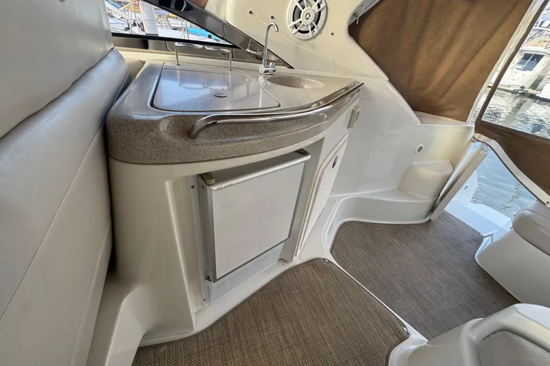 Slide: The Image of Interior of 2002 Regal Commodore 3860 yacht with kitchenette and seating area. - 20